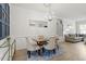 Inviting dining area with stylish furnishings, a large mirror, and plenty of natural light at 225 Mayfield Dr, Apex, NC 27539