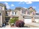 Charming townhome boasts tidy landscaping, an attached two-car garage, and a patriotic display at 225 Mayfield Dr, Apex, NC 27539