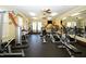 Well-equipped community gym with various exercise machines and ample natural light at 225 Mayfield Dr, Apex, NC 27539
