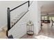 Bright hallway leads to a living room, featuring clean lines, neutral colors, and luxury vinyl flooring at 225 Mayfield Dr, Apex, NC 27539