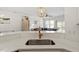 Bright kitchen with stainless steel appliances, quartz countertops, and decorative pendant lighting at 225 Mayfield Dr, Apex, NC 27539