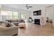 Spacious living room with hardwood floors, fireplace, and lots of natural light at 225 Mayfield Dr, Apex, NC 27539
