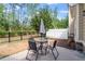 Outdoor patio featuring a table with four chairs, perfect for dining al fresco at 225 Mayfield Dr, Apex, NC 27539