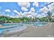 Community pool featuring various umbrellas, fountains, and seating areas for residents at 225 Mayfield Dr, Apex, NC 27539