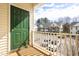Balcony with green door and views of the community with nearby parking at 2421 Kudrow Ln, Morrisville, NC 27560