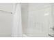 Close up of an all-white bathtub and shower, complete with a shower curtain at 2421 Kudrow Ln, Morrisville, NC 27560