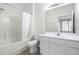 Clean bathroom featuring a shower-tub combination, a white vanity, and a large mirror at 2421 Kudrow Ln, Morrisville, NC 27560