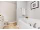 Bathroom featuring a soaking tub with chrome fixtures and a tiled shower at 25 Cornfield Ln, Benson, NC 27504