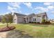 Inviting single-story home boasts a beautiful lawn, manicured landscaping, and an attached two-car garage at 25 Cornfield Ln, Benson, NC 27504