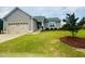 Charming single-story home features a manicured lawn, two-car garage, and traditional curb appeal at 25 Cornfield Ln, Benson, NC 27504