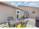 Inviting patio with comfortable seating, an outdoor dining area, and charming decorative elements at 25 Cornfield Ln, Benson, NC 27504