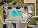 Aerial view of community pools, lounge seating, and surrounding landscaped grounds at 2528 Forge Village Way, Apex, NC 27523