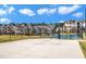 Exterior shot of a basketball court and community apartment buildings on a sunny day at 2528 Forge Village Way, Apex, NC 27523