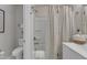 Clean bathroom featuring a toilet, shower with curtain, and a neutral color scheme at 2528 Forge Village Way, Apex, NC 27523