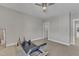 Spacious bedroom with large window, and workout equipment at 2528 Forge Village Way, Apex, NC 27523