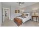 Bright bedroom showcasing neutral walls, a comfy bed, and an area rug on carpeted floors at 2528 Forge Village Way, Apex, NC 27523
