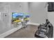 Gaming area with TVs, gaming consoles, controllers and comfortable leather chairs at 2528 Forge Village Way, Apex, NC 27523