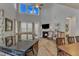 Well-lit living room with fireplace, comfortable seating, and open layout at 2528 Forge Village Way, Apex, NC 27523