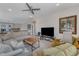 Spacious loft area features comfortable seating, flat screen television, and ceiling fan at 2528 Forge Village Way, Apex, NC 27523