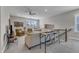 Cozy loft area features carpet flooring, neutral colors, and plenty of seating at 2528 Forge Village Way, Apex, NC 27523