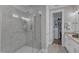 Spacious tiled shower features glass surround, dual shower heads, and convenient shelf at 2528 Forge Village Way, Apex, NC 27523
