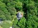 An aerial view of the house surrounded by lush trees, gray roof, and well-kept lawn at 2901 Hunters Bluff Dr, Raleigh, NC 27606