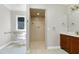 Well-lit bathroom showcasing an accessible shower and coordinated fixtures at 2901 Hunters Bluff Dr, Raleigh, NC 27606