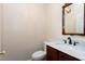Cozy powder room with marble countertop, updated fixtures, and pedestal sink at 2901 Hunters Bluff Dr, Raleigh, NC 27606