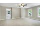 Spacious bedroom featuring a ceiling fan and multiple windows providing ample natural light at 2901 Hunters Bluff Dr, Raleigh, NC 27606
