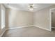 Cozy bedroom showcasing neutral carpet and a ceiling fan with a light fixture, offering comfortable living at 2901 Hunters Bluff Dr, Raleigh, NC 27606