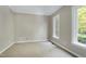 Neutral bedroom with plush carpet and window overlooking the outdoors at 2901 Hunters Bluff Dr, Raleigh, NC 27606