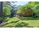 Brick home with large lawn, mature trees and shrubs at 2901 Hunters Bluff Dr, Raleigh, NC 27606