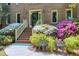 Elegant brick home entrance with decorative landscaping and stylish entrance way at 2901 Hunters Bluff Dr, Raleigh, NC 27606