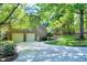 A detached two-car garage with a brick exterior and an adjacent ramp for easy access at 2901 Hunters Bluff Dr, Raleigh, NC 27606