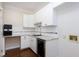 Bright kitchen features white cabinets, granite countertops, tiled backsplash, and stainless steel wine cooler at 2901 Hunters Bluff Dr, Raleigh, NC 27606