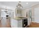 Open kitchen showcases a center island with stove and oven, and views into adjacent living spaces at 2901 Hunters Bluff Dr, Raleigh, NC 27606