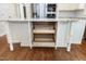 Kitchen island with storage, featuring wooden drawers and white cabinetry in an open and accessible design at 2901 Hunters Bluff Dr, Raleigh, NC 27606