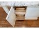 Open kitchen island showcasing storage solutions with wooden drawers inside white cabinets at 2901 Hunters Bluff Dr, Raleigh, NC 27606
