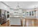 Spacious kitchen with white cabinets, granite island, and stainless steel appliances at 2901 Hunters Bluff Dr, Raleigh, NC 27606