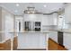 Beautiful kitchen with white cabinets, stainless steel appliances, granite countertops, and a stylish island at 2901 Hunters Bluff Dr, Raleigh, NC 27606
