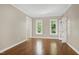 Bright living space boasting hardwood floors, white trim, and views of greenery at 2901 Hunters Bluff Dr, Raleigh, NC 27606