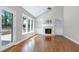 Bright living room with hardwood floors, fireplace, built-in shelving, and vaulted ceiling at 2901 Hunters Bluff Dr, Raleigh, NC 27606