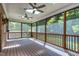 Screened porch features ceiling fans, skylights, and wood flooring at 2901 Hunters Bluff Dr, Raleigh, NC 27606