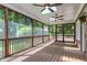 Screened porch features ceiling fans, skylights, and wood flooring at 2901 Hunters Bluff Dr, Raleigh, NC 27606