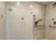Close-up of tiled shower with accessible grab bar and niche storage at 2901 Hunters Bluff Dr, Raleigh, NC 27606