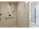 Modern shower featuring a tiled wall and showerhead with safety bar at 2901 Hunters Bluff Dr, Raleigh, NC 27606