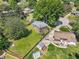 Aerial view of the property shows a spacious yard with outbuildings and mature landscaping at 2904 Falkirk Pl, Raleigh, NC 27604