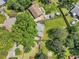 An aerial shot of the property shows a large yard and mature trees and landscaping at 2904 Falkirk Pl, Raleigh, NC 27604