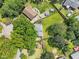 An aerial view showcases the home and its spacious, tree-filled yard and neighborhood at 2904 Falkirk Pl, Raleigh, NC 27604