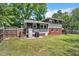 View of the expansive backyard, enclosed by a wooden fence for privacy and security at 2904 Falkirk Pl, Raleigh, NC 27604